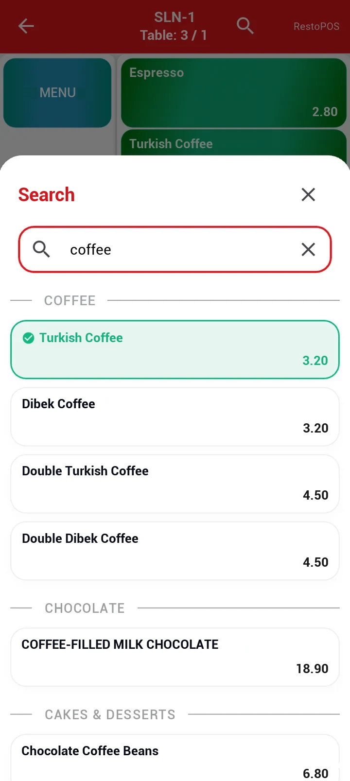 Item search: a search for coffee, results headed by menu group, the item already in the basket marked